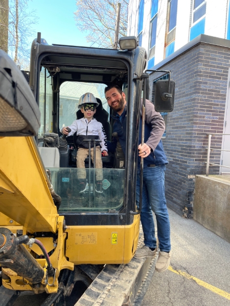 IMG_0886 Benderson Development child in excavator machine with adult